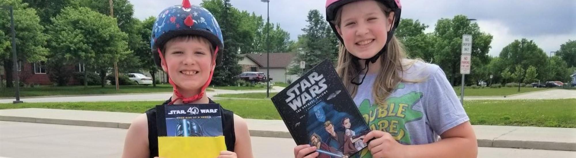 Young students receiving free books